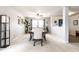 Elegant dining room with table seating, bright windows, and a modern light fixture at 8088 Lantern Ln, Pendleton, IN 46064
