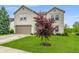 Beautiful home with lush front lawn and mature landscaping, offering great curb appeal at 8088 Lantern Ln, Pendleton, IN 46064