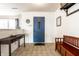 Inviting foyer with blue front door, coat rack, and stylish bench seating, creating a warm welcome at 8088 Lantern Ln, Pendleton, IN 46064