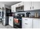 Modern kitchen featuring white cabinetry, black appliances and hardware, and a cozy aesthetic at 8088 Lantern Ln, Pendleton, IN 46064
