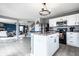 Open-concept kitchen with an island that offers seating and view into the living room at 8088 Lantern Ln, Pendleton, IN 46064