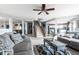 Spacious living room with comfortable seating, a staircase, and view into kitchen area at 8088 Lantern Ln, Pendleton, IN 46064