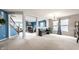 Bright living room with open concept design and modern staircase, perfect for entertaining guests at 8088 Lantern Ln, Pendleton, IN 46064