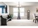 Cozy living space with seating bench, lots of natural light, and stylish light fixture at 8088 Lantern Ln, Pendleton, IN 46064