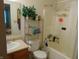 A full bathroom with a shower-tub combo, a vanity, and a mirror, providing a functional and comfortable space at 8165 Amarillo Dr, Indianapolis, IN 46237
