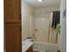 A tidy full bathroom with a shower-tub combo, vanity, and mirror, providing essential functionality and comfort at 8165 Amarillo Dr, Indianapolis, IN 46237