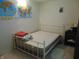 This bedroom features a map of the United States and the world, a bed and storage space at 8165 Amarillo Dr, Indianapolis, IN 46237