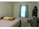 A well lit bedroom featuring a bed, natural light, and practical curtains for a cozy and comfortable rest at 8165 Amarillo Dr, Indianapolis, IN 46237