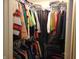 A walk-in closet with ample storage space, featuring rods and shelves for organizing clothes and accessories at 8165 Amarillo Dr, Indianapolis, IN 46237