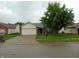 Charming single-Gathering home featuring brick and vinyl siding, a two-car garage, and mature landscaping at 8165 Amarillo Dr, Indianapolis, IN 46237