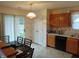 Well-lit kitchen with light wood cabinetry, modern appliances, and an adjacent dining area at 8165 Amarillo Dr, Indianapolis, IN 46237