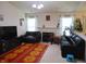 Bright living room featuring a cozy fireplace, large windows, and comfortable seating arrangements at 8165 Amarillo Dr, Indianapolis, IN 46237