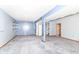 Spacious basement featuring a light blue accent wall with shelving and access to other areas of the home at 8530 Ardennes Dr, Fishers, IN 46038