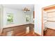 Bright bedroom with hardwood floors, natural light from two windows, and a walk-in closet at 8530 Ardennes Dr, Fishers, IN 46038