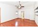 Bedroom featuring hardwood floors, ceiling fan, and ensuite bathroom access at 8530 Ardennes Dr, Fishers, IN 46038