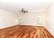 Bonus room with hardwood floors, a ceiling fan, and large windows for ample natural light at 8530 Ardennes Dr, Fishers, IN 46038