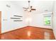 Bonus room with hardwood floors, a ceiling fan, and ample space with decorative shelves at 8530 Ardennes Dr, Fishers, IN 46038