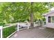 Large deck with black metal railing provides a beautiful outdoor space for relaxation and entertaining at 8530 Ardennes Dr, Fishers, IN 46038