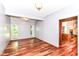 Open dining room featuring hardwood floors and natural light from large windows at 8530 Ardennes Dr, Fishers, IN 46038