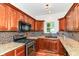 Updated kitchen featuring stainless steel appliances, granite countertops, and stylish backsplash at 8530 Ardennes Dr, Fishers, IN 46038