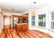 Eat in kitchen with stainless steel appliances, granite counters, and beautiful hardwood flooring at 8530 Ardennes Dr, Fishers, IN 46038