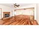 Spacious living room features a fireplace and hardwood flooring, creating a cozy and inviting atmosphere at 8530 Ardennes Dr, Fishers, IN 46038