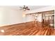 Open-concept living area with hardwood floors, offering ample space and flow between the living room, kitchen, and dining areas at 8530 Ardennes Dr, Fishers, IN 46038