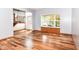 Bright living room featuring hardwood floors, a large window, and an entryway at 8530 Ardennes Dr, Fishers, IN 46038