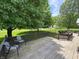 Spacious wooden deck overlooking a yard shaded by a large tree at 8711 E 296Th St, Atlanta, IN 46031
