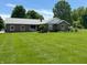 Charming brick ranch-style home with lush green lawn and mature trees at 8711 E 296Th St, Atlanta, IN 46031