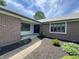 Inviting brick home entrance with a curved walkway and manicured landscaping at 8711 E 296Th St, Atlanta, IN 46031