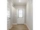 Bright entryway featuring a white door with glass panel and decorative curtains at 9718 Haughton Ln, McCordsville, IN 46055