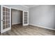 Office space with glass french doors and wood-look flooring at 9718 Haughton Ln, McCordsville, IN 46055