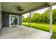 Covered patio with ceiling fan, lights and a view of the backyard at 9718 Haughton Ln, McCordsville, IN 46055