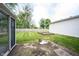 View of backyard featuring a patio area, privacy fence and garage at 10244 Washington Blvd, Carmel, IN 46280