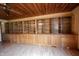 Detailed shot of the living room's extensive built-in shelving and cabinetry with light wood finish at 10244 Washington Blvd, Carmel, IN 46280