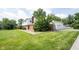 Back view of the house showing a two-car garage and well-kept lawn at 10244 Washington Blvd, Carmel, IN 46280
