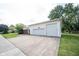 Spacious two-car garage with a concrete driveway for easy parking at 10244 Washington Blvd, Carmel, IN 46280