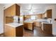 Spacious kitchen with wooden cabinets, modern appliances, and a central island at 10244 Washington Blvd, Carmel, IN 46280