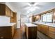 Bright kitchen features wooden cabinets, an island, and ample counter space at 10244 Washington Blvd, Carmel, IN 46280