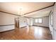 Open living area with chandelier lighting, wood floors, and lots of natural light at 10244 Washington Blvd, Carmel, IN 46280