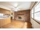 Spacious living room boasts a brick fireplace, hardwood floors, and large windows at 10244 Washington Blvd, Carmel, IN 46280