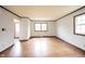 Bright living room features classic trim, hardwood floors and large windows at 10244 Washington Blvd, Carmel, IN 46280
