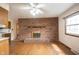 Open-concept living space features a brick fireplace and hardwood floors at 10244 Washington Blvd, Carmel, IN 46280