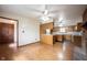 Spacious kitchen flows seamlessly into living area with brick fireplace and ceiling fans at 10244 Washington Blvd, Carmel, IN 46280