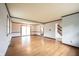 Bright and airy living area with wood floors, dining area, and a staircase visible at 10244 Washington Blvd, Carmel, IN 46280