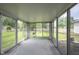 Bright sunroom featuring multiple windows with views of the fenced backyard and garden at 10244 Washington Blvd, Carmel, IN 46280