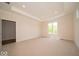 Spacious bedroom with recessed lights, tray ceiling, neutral carpet and natural light at 10586 Jacks Way, Indianapolis, IN 46234