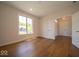 Bright and open bedroom with hardwood floors and a large window at 10586 Jacks Way, Indianapolis, IN 46234