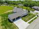 Aerial view of the home's garage with a long driveway and well-kept lawn at 10586 Jacks Way, Indianapolis, IN 46234